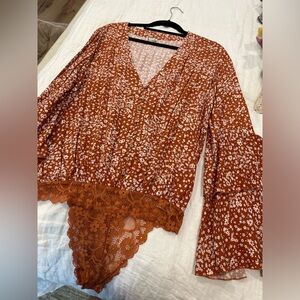 Free people Orange floral body suit